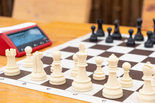 Chess tournament boards ready with chess clock chairs and tables