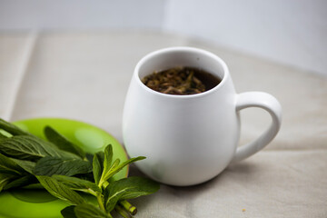 mint tea on white background with mint leaves