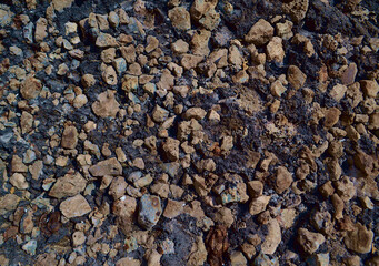 surface of stones of different sizes, colors and shades