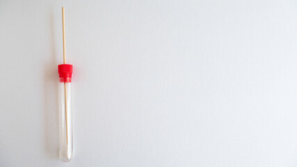Medical swab for sampling and transporting bacteria for culture on a white background.