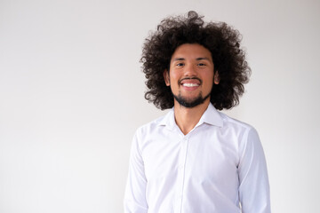 Fototapeta na wymiar Portrait of Latin American man with big hair and smiling 