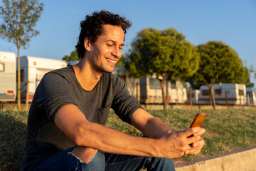 Fototapeta premium Portrait of young man using the mobile phone
