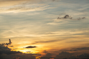 Obraz na płótnie Canvas Beautiful sunset sky above clouds with dramatic light.