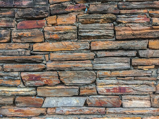 Colorfull layers of stone form a wall 3