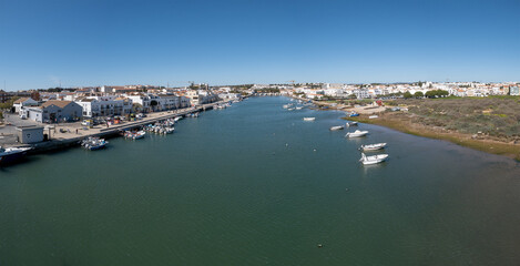 Fototapeta na wymiar Tavira, Algarve, Portugal: panorama of the city seen from the bridge over the Gilao river
