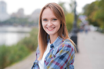 Portrait of a beautiful and happy girl outdoors