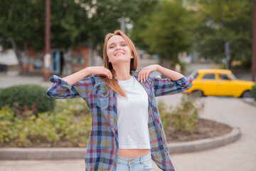 Portrait of a girl who rejoices on the street