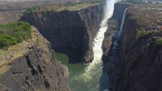 Revealing aerial shot of Victoria Falls Canyon from Zambia