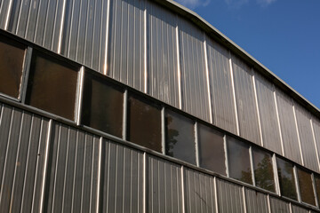 Fototapeta na wymiar Equipment storage hangar. Industrial temporary building. 