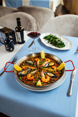 Spanish dishes seafood paella and padron peppers