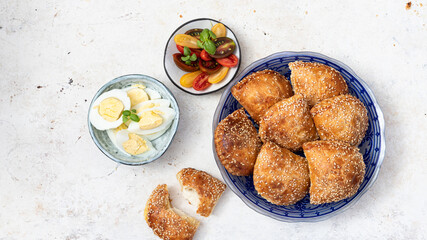 Plate with Burek, eggs,  and salad. Mediterranean style breakfast