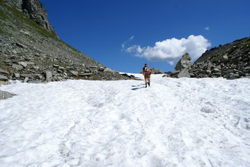 Naklejka na ściany i meble Alpe Devero, Piedmont, Italy: hikers walking on the snow of glacier