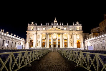 Fototapeta premium Saint Peter Basilica in Vatican City illuminated by night, masterpiece of Michelangelo and Bernini