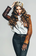 attractive woman in leather jacket and golden crown