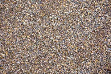 Textur mit kleinen Steinen in verschiedenen Beigetönen