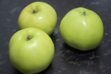 three winter green apples