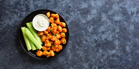 Poster Cauliflower buffalo wings with celery and sauce © voltan