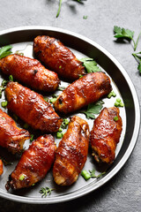 Bacon wrapped grilled chicken wings