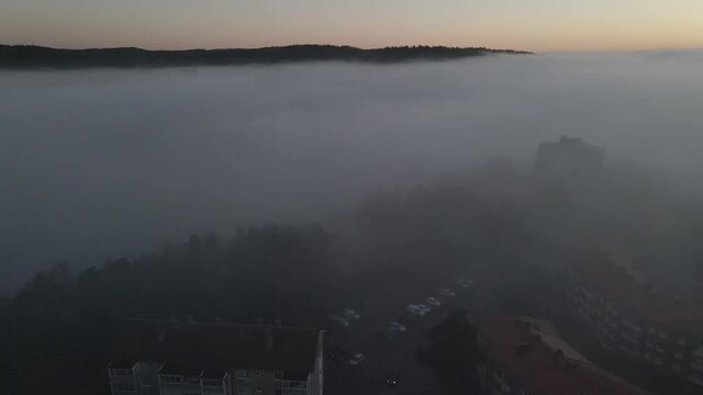 Drone shot over Bor&aring;s Sweden. Crossing the freeway, trees and a lake.
