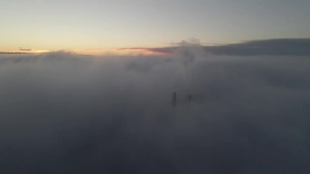 Drone shot over Bor&aring;s Sweden. Crossing the freeway, trees and a lake.