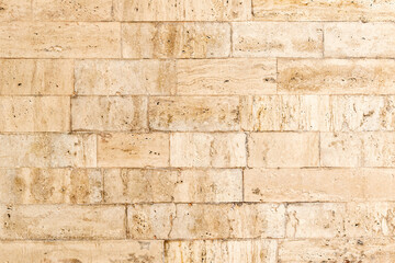 Background, texture, beige marbled brick wall