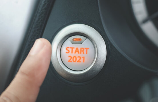 Finger is pressing the start button 2021 in the concept of starting the new year