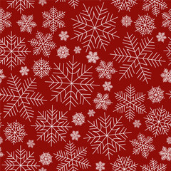 Christmas seamless pattern of snowflakes on a red background