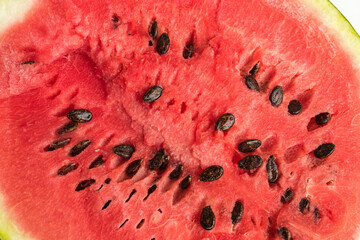 The pulp of a red ripe watermelon with seeds
