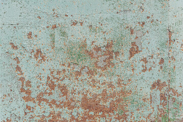 abstract background of an old painted turquoise rusty metal surface close up