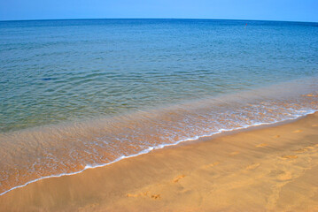 Sand and surf on the beach of Phu Quoc island in Vietnam
