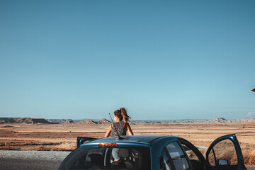 Girl traveling through the desert