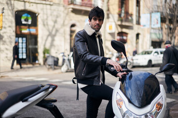 Bearded ethnic man with scooter