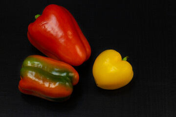 Green Yellow Red Paprika. Peppers isolated on black