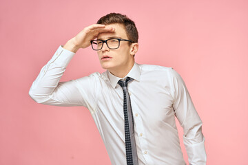 Business man in white shirt with tie wearing glasses self-confidence official pink background