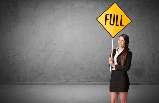 Young Business Person Holding Road Sign With FULL Inscription, New Rules Concept