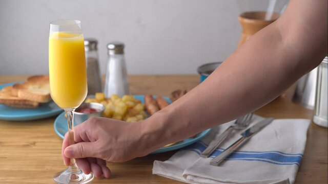 american breakfast with mimosa on wooden table top