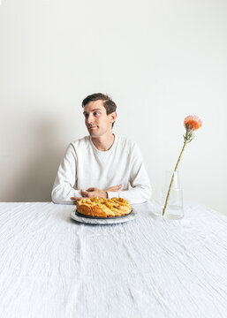 Portrait of boy, flowers and bread