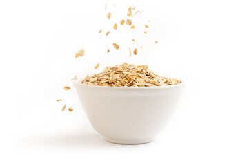 Front view of oat flakes on a ceramic bowl