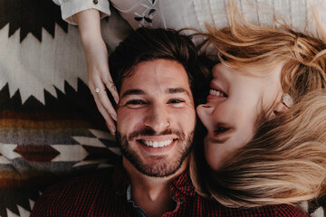 A young engaged couple posing for portraits