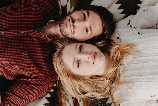 A young engaged couple posing for portraits
