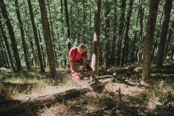 Man cutting wood with a chainsaw
