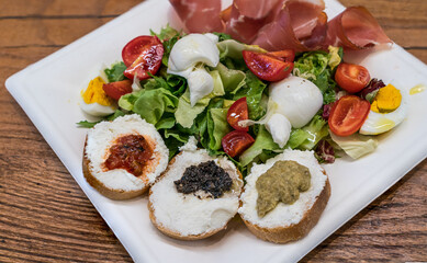 Ricotta Bruschetta with Italian salad and mozzarella cheese