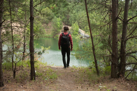 photo behind man on the background of a lake in the forest