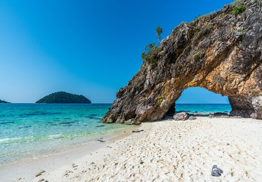 White sand beach and Stone arch in Koh Khai near Koh Lipe, Satun, Thailand