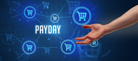 Close-Up of cropped hand pointing at PAYDAY inscription, online shopping concept