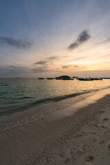 Obraz premium Beautiful sunrise at turquoise sunrise beach in Lipe Island, Satun, Thailand.