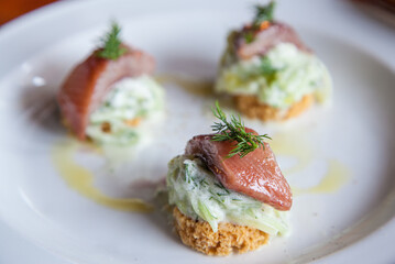 Marinated Herring and cucumber and feta cream