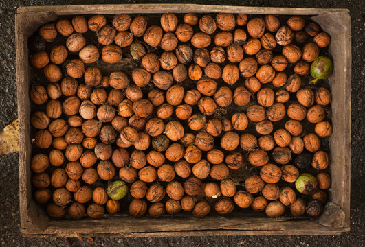 many nuts in wooden box
