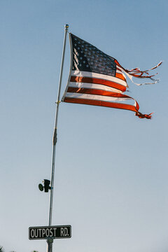 Weathered American Flag Blowing in the Wind