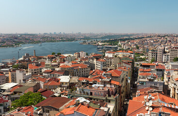Fototapeta na wymiar Istanbul, Turkey / May 9, 2016: City skyline view of Istanbul from Galata tower, old houses in Beyoglu district and Golden Horn landscape.